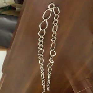 Silver 34-35” necklace or belt. Adjustable